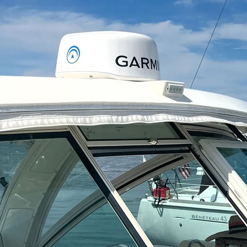 Slide: The Image of 2016 World Cat 320 DC boat with Garmin radar, docked near a Beneteau 43. - 28