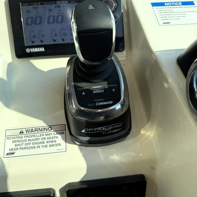 Slide: The Image of Control panel of a 2016 World Cat 320 DC boat with Optimus 360 joystick. - 32