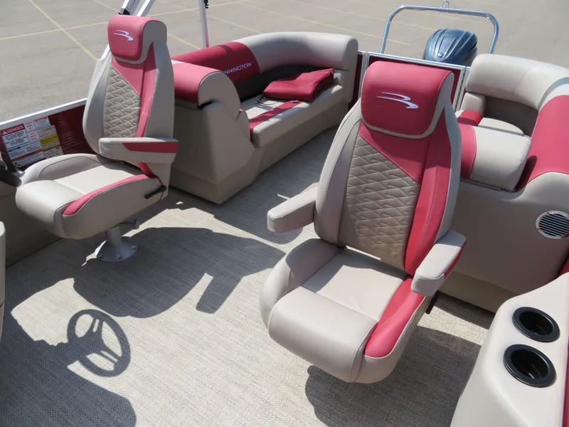 Slide: The Image of 2024 Bennington 22 SSR pontoon boat interior with red and beige seating. - 14