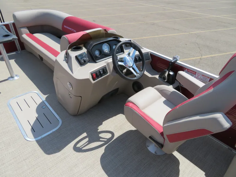 Slide: The Image of 2024 Bennington 22 SSR boat interior with steering console and seating. - 9
