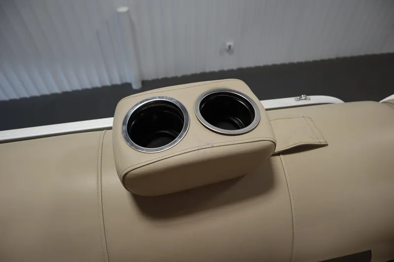 Slide: The Image of Cup holders on beige seating, 2022 Tracker 20 Party Barge DLX boat. - 19