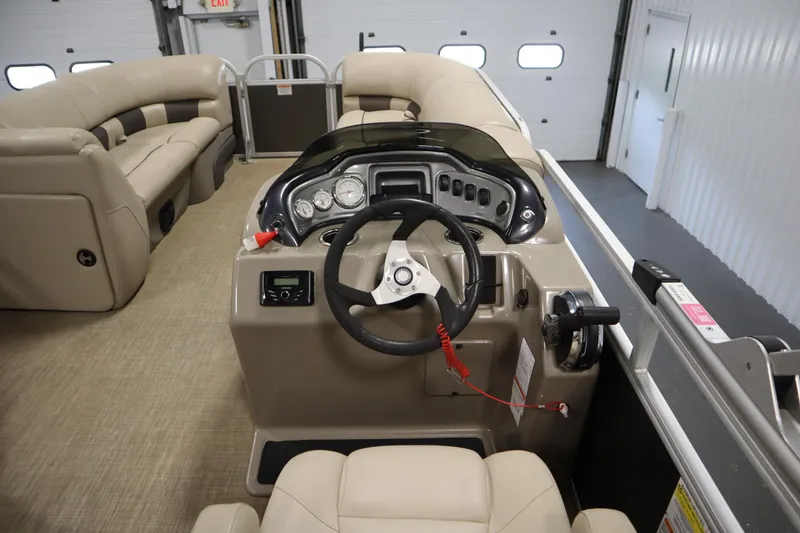 Slide: The Image of 2022 Tracker 20 Party Barge DLX pontoon boat interior with steering console. - 24