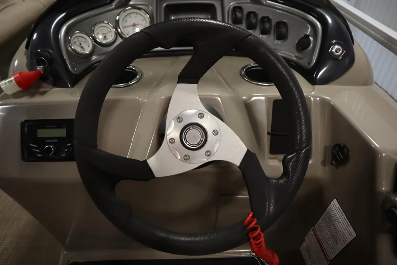 Slide: The Image of Steering wheel and dashboard of 2022 Tracker 20 Party Barge DLX boat. - 25