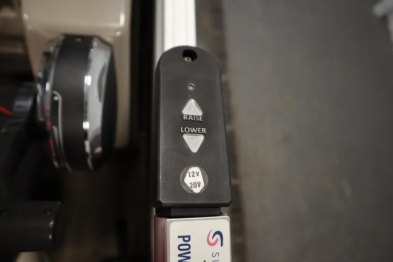 Slide: The Image of Control panel of 2022 Tracker 20 Party Barge DLX with raise and lower buttons. - 31