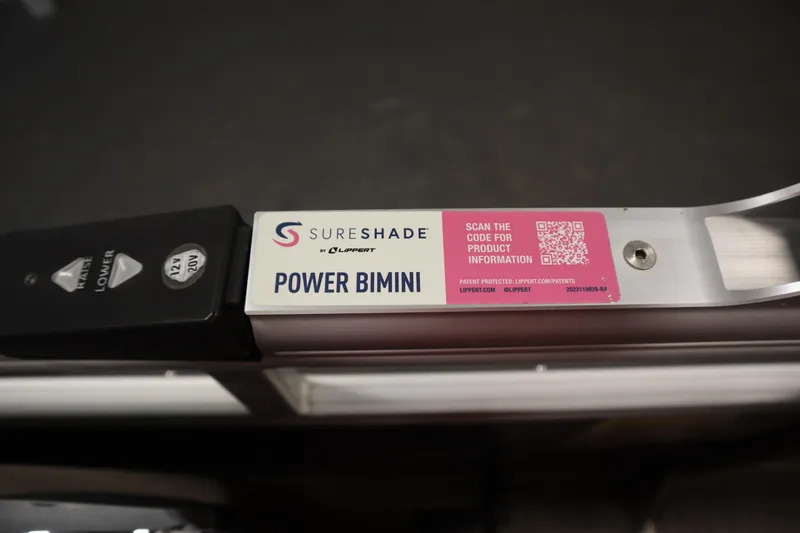 Slide: The Image of SureShade Power Bimini control panel on 2022 Tracker 20 Party Barge DLX boat. - 32