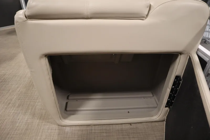 Slide: The Image of 2022 Tracker 20 Party Barge DLX storage compartment with beige upholstery. - 36