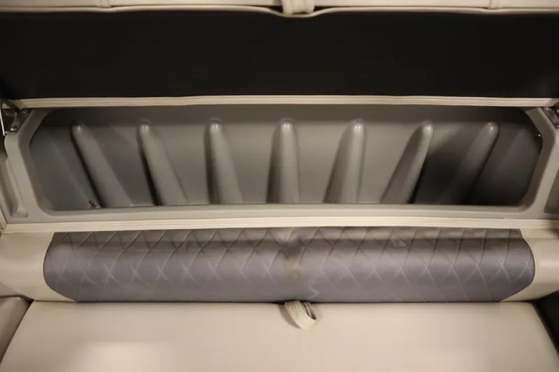 Slide: The Image of 2022 Tracker 20 Party Barge DLX storage compartment with quilted seat detail. - 38