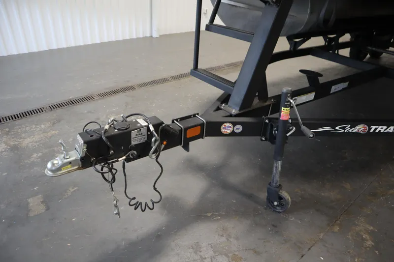 Slide: The Image of Trailer hitch of 2022 Tracker 20 Party Barge DLX in a garage setting. - 49