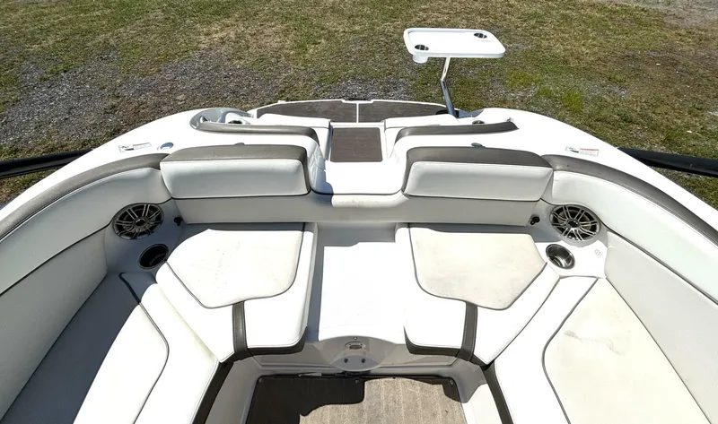 Slide: The Image of 2013 Yamaha Boats 242 Limited S interior with white seating and table. - 14