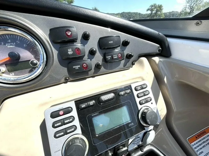 Slide: The Image of Dashboard of 2013 Yamaha Boats 242 Limited S with controls and gauges. - 21