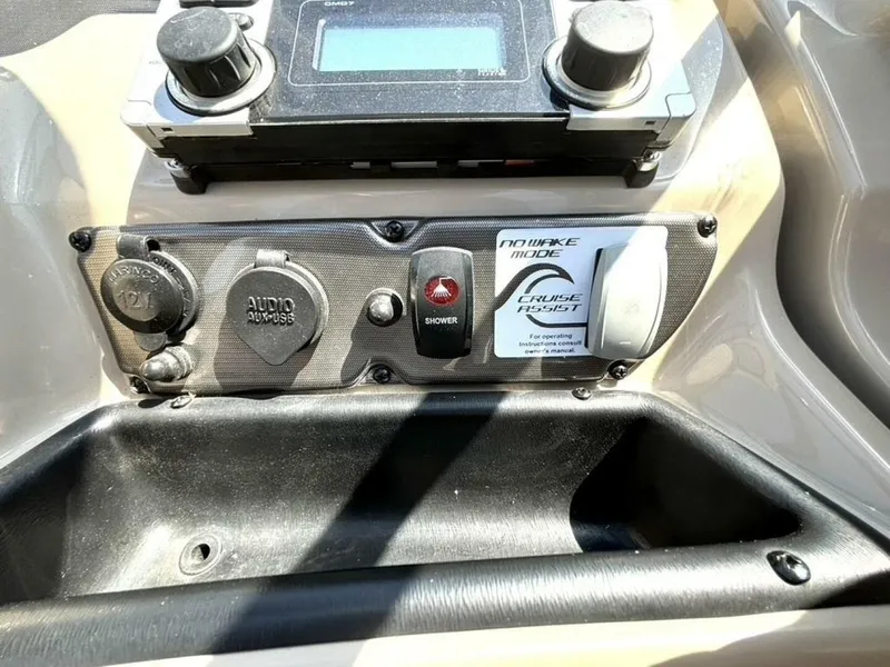 Slide: The Image of Control panel of a 2013 Yamaha Boats 242 Limited S with audio and cruise assist features. - 22