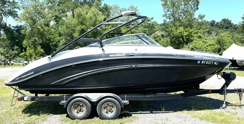 Slide: The Image of 2013 Yamaha Boats 242 Limited S on trailer, parked outdoors. - 6