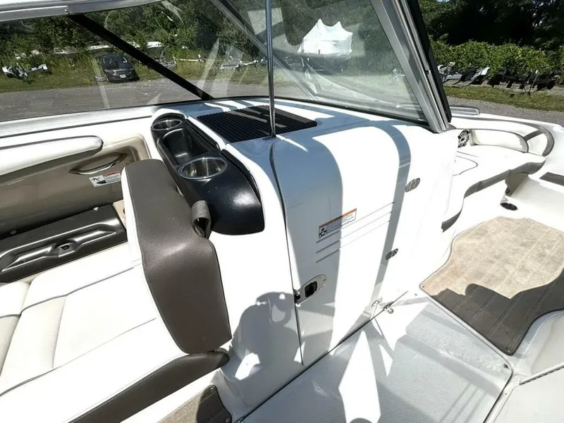 Slide: The Image of 2013 Yamaha Boats 242 Limited S interior with seating and cup holders. - 29