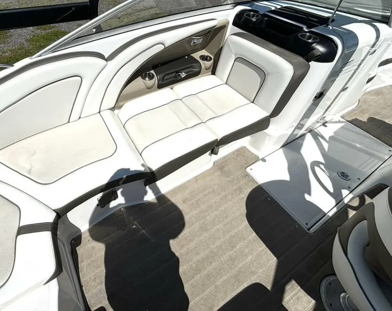 Slide: The Image of 2013 Yamaha Boats 242 Limited S interior with white seating and cup holders. - 17