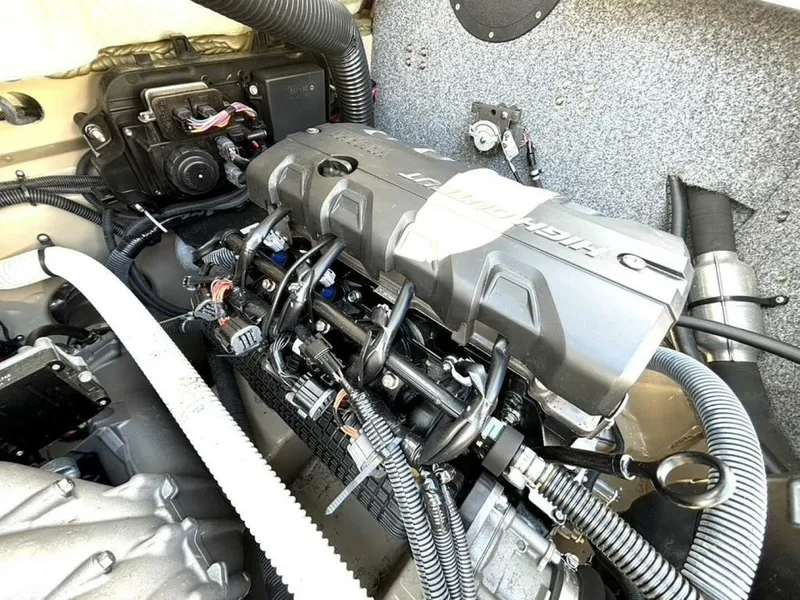 Slide: The Image of Engine compartment of a 2013 Yamaha Boats 242 Limited S, showcasing intricate mechanical components. - 35
