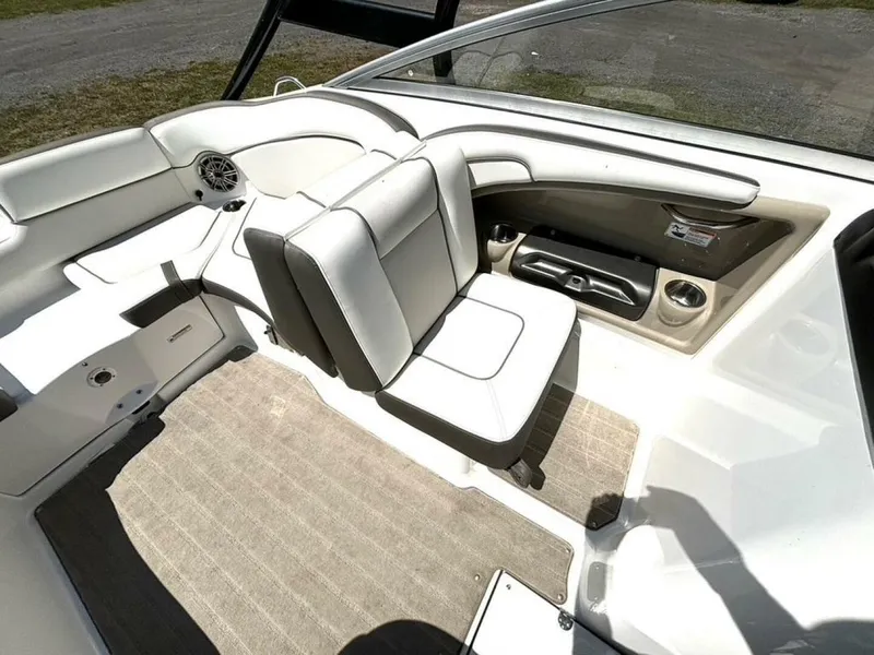 Slide: The Image of 2013 Yamaha Boats 242 Limited S interior with white seating and carpeted flooring. - 18