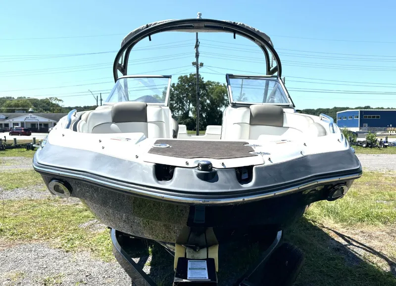 Slide: The Image of 2013 Yamaha Boats 242 Limited S on trailer, showcasing sleek design and spacious interior. - 8