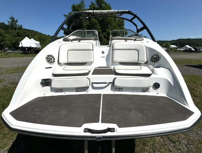 Slide: The Image of 2013 Yamaha Boats 242 Limited S, rear view, showcasing seating and swim platform. - 9
