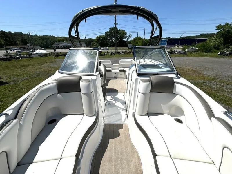 Slide: The Image of 2013 Yamaha Boats 242 Limited S interior with spacious seating and sleek design. - 28