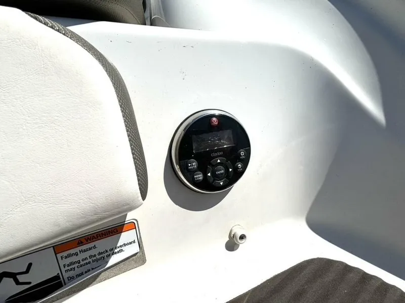 Slide: The Image of Control panel on 2013 Yamaha Boats 242 Limited S, featuring Clarion audio system. - 10