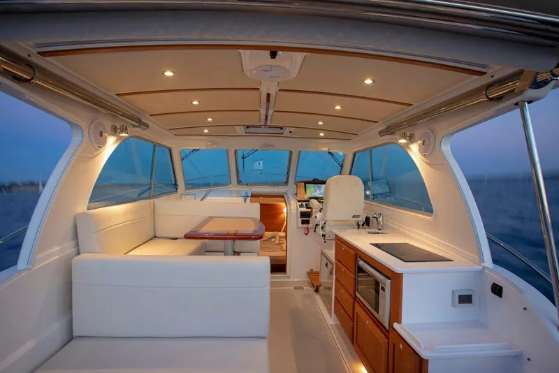 Slide: The Image of Luxurious interior of 2026 Back Cove 34O yacht with seating and kitchenette. - 5