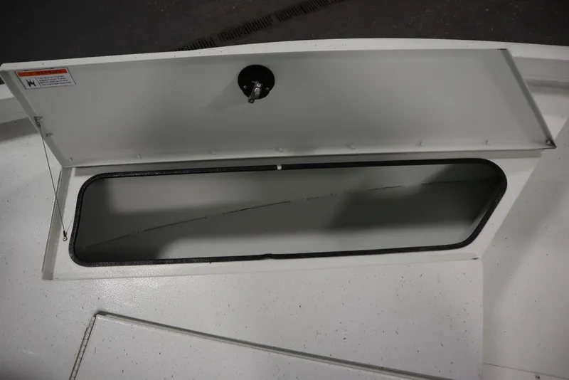 Slide: The Image of Open storage compartment on 2020 Sun Tracker Party Barge 20 DLX boat. - 16