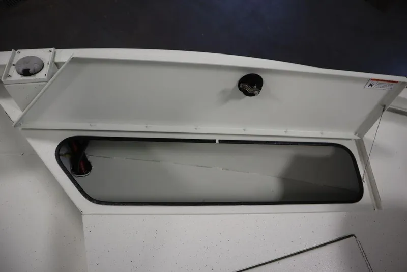 Slide: The Image of Open storage compartment on 2020 Sun Tracker Party Barge 20 DLX boat. - 17