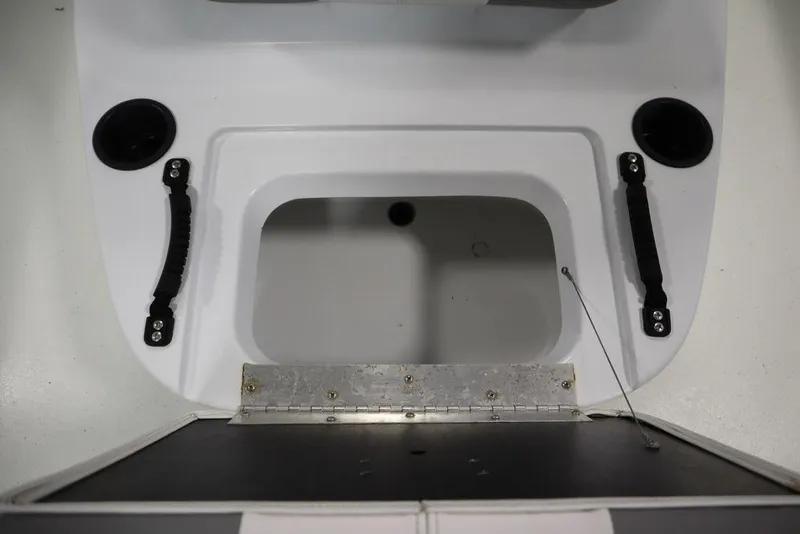 Slide: The Image of 2020 Sun Tracker Party Barge 20 DLX boat interior with storage compartment and handles. - 18