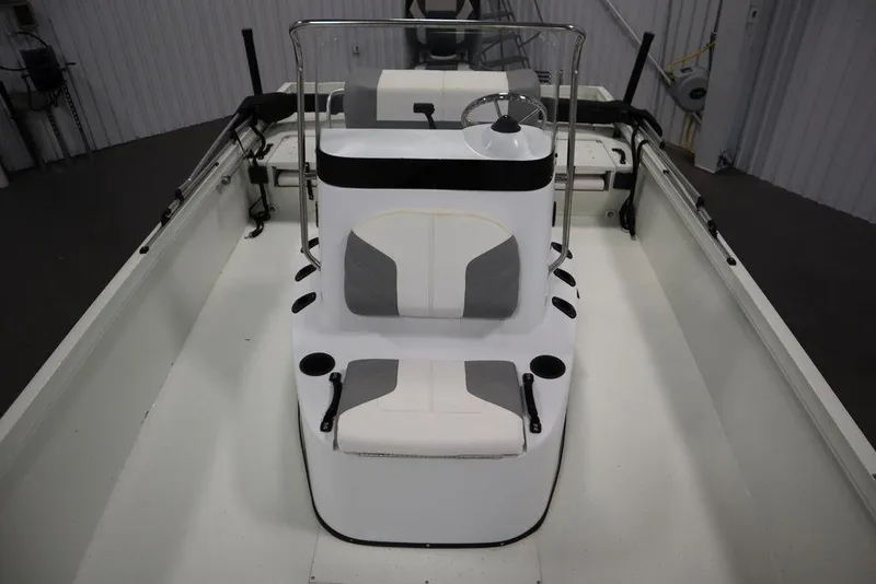 Slide: The Image of 2020 Sun Tracker Party Barge 20 DLX interior with seating and steering console. - 19