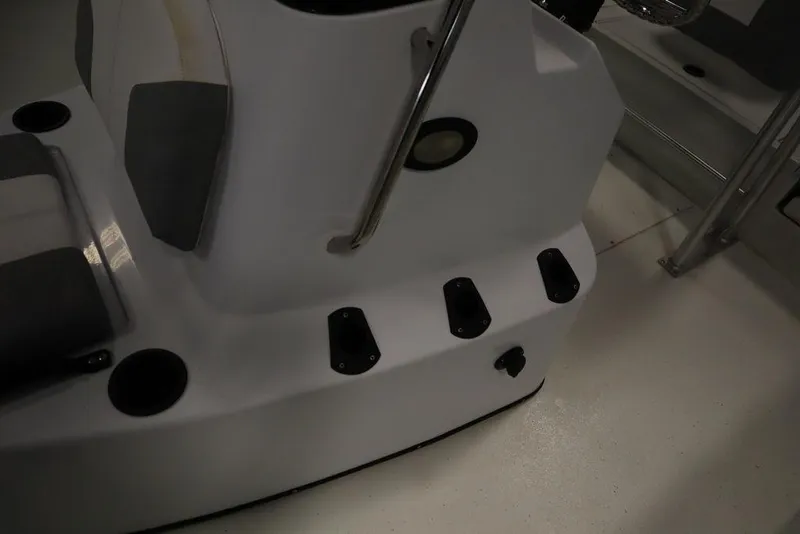 Slide: The Image of 2020 Sun Tracker Party Barge 20 DLX interior with seating and cup holders. - 23