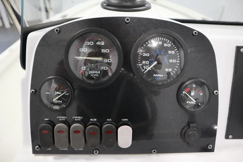 Slide: The Image of Dashboard of 2020 Sun Tracker Party Barge 20 DLX with gauges and switches. - 26