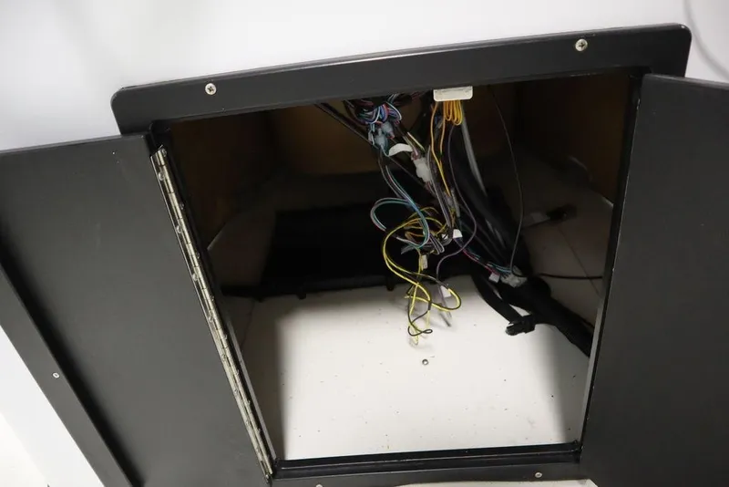 Slide: The Image of Open cabinet with exposed wiring in 2020 Sun Tracker Party Barge 20 DLX. - 31