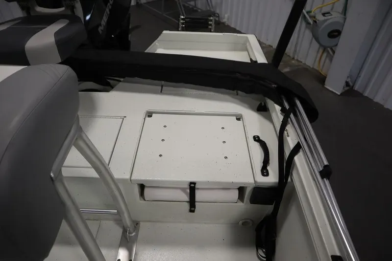 Slide: The Image of 2020 Sun Tracker Party Barge 20 DLX interior with seating and storage compartments. - 32