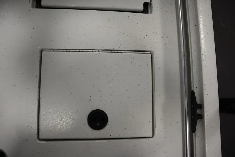 Slide: The Image of 2020 Sun Tracker Party Barge 20 DLX deck detail with storage compartment and railing. - 42