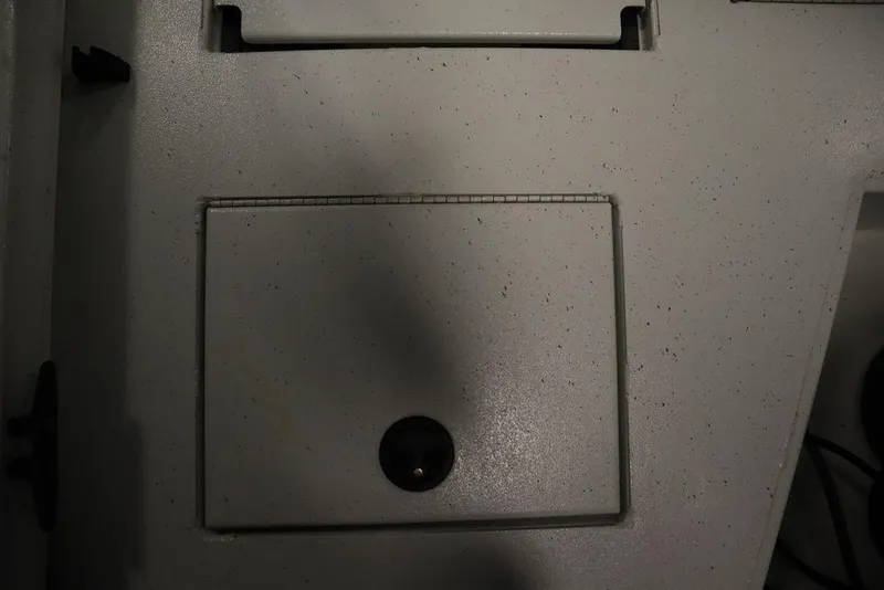 Slide: The Image of 2020 Sun Tracker Party Barge 20 DLX deck with storage compartment and latch. - 44