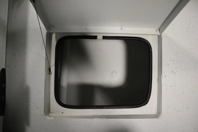 Slide: The Image of Open storage compartment on 2020 Sun Tracker Party Barge 20 DLX boat. - 45