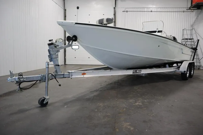 Slide: The Image of 2020 Sun Tracker Party Barge 20 DLX on trailer in indoor storage. - 48