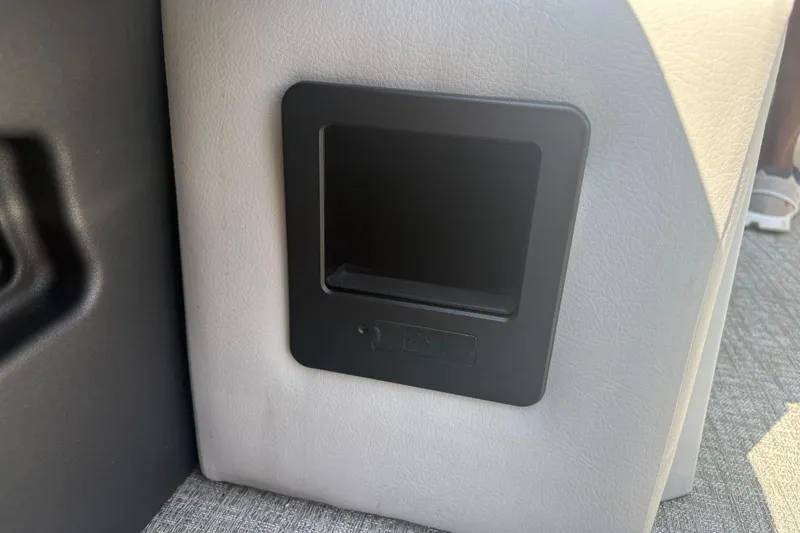 Slide: The Image of 2024 Avalon Catalina Entertainer interior detail with black panel on light upholstery. - 13