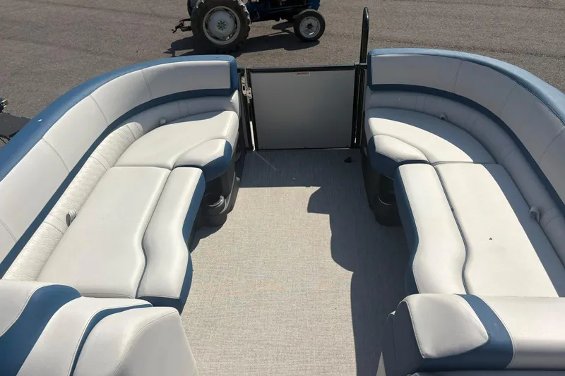 Slide: The Image of 2024 Avalon Catalina Entertainer boat interior with spacious seating and modern design. - 18