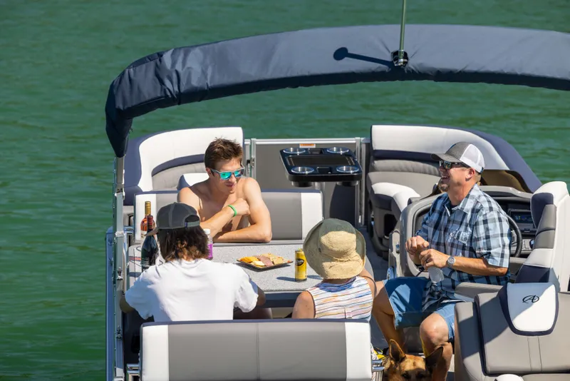 Slide: The Image of People enjoying a sunny day on a 2024 Avalon Catalina Entertainer boat. - 7