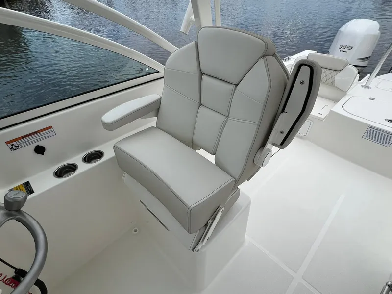 Slide: The Image of Luxury seating on 2025 World Cat 230 DC boat, featuring modern design and comfort. - 14