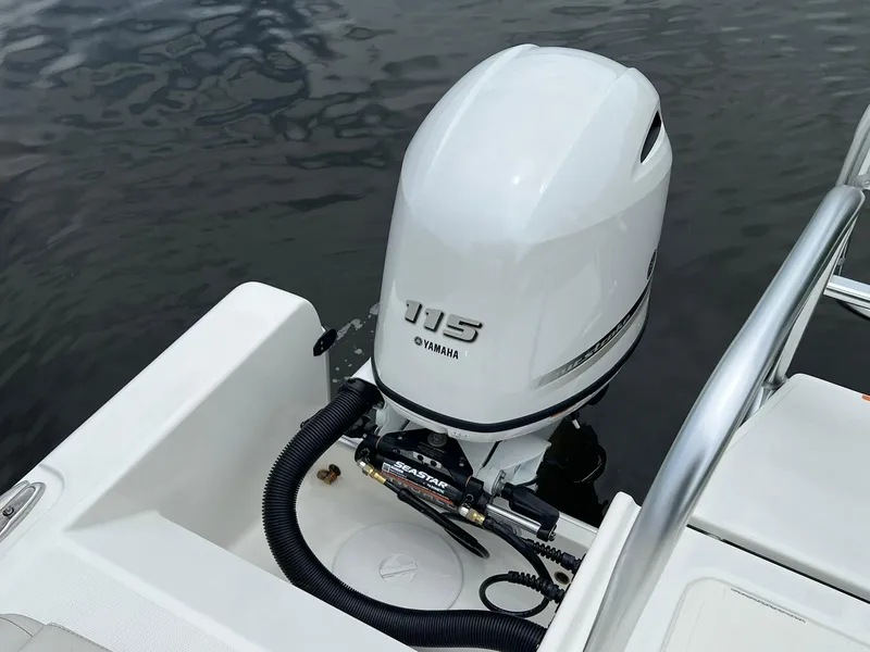 Slide: The Image of Outboard motor on 2025 World Cat 230 DC boat, featuring Yamaha 115 engine. - 17