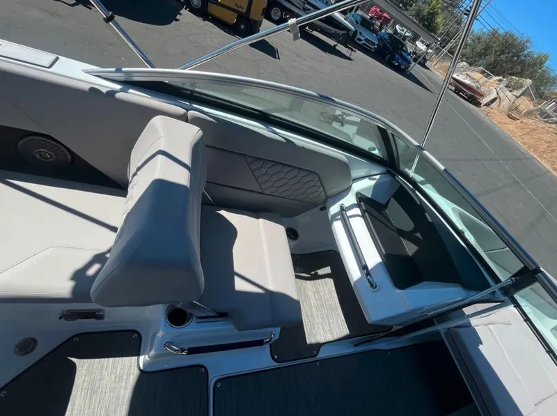 Slide: The Image of 2023 Four Winns H1 boat interior with modern seating and sleek design. - 10