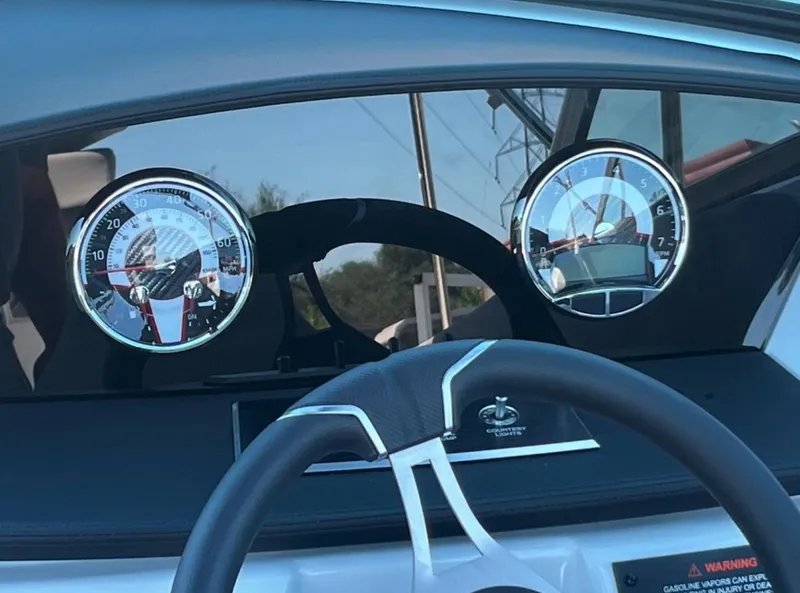 Slide: The Image of Dashboard of 2023 Four Winns H1 boat with steering wheel and gauges. - 17