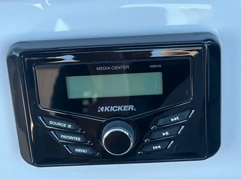 Slide: The Image of Kicker KMC45 media center in 2023 Four Winns H1 boat dashboard. - 18