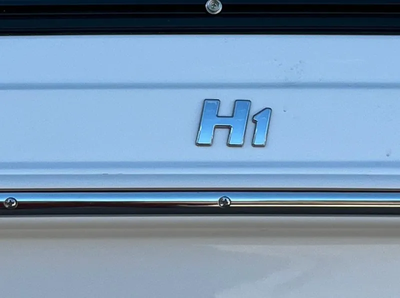 Slide: The Image of 2023 Four Winns H1 boat emblem on a white surface. - 21