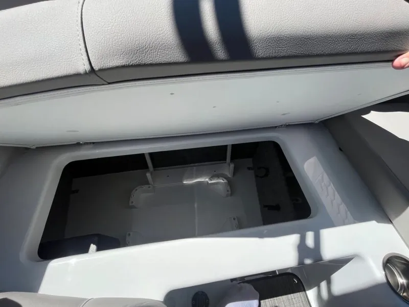 Slide: The Image of Open storage compartment in 2023 Four Winns H1 boat, showcasing interior space. - 23