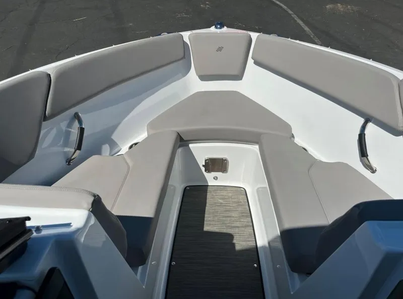 Slide: The Image of 2023 Four Winns H1 boat interior with gray seating and sleek design. - 28