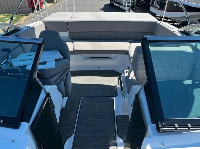 Slide: The Image of 2023 Four Winns H1 boat interior with seating and glass windshields. - 30