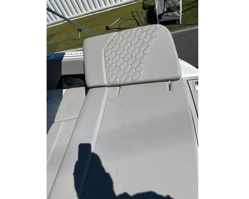 Slide: The Image of 2023 Four Winns H1 boat seat with hexagonal pattern upholstery. - 5